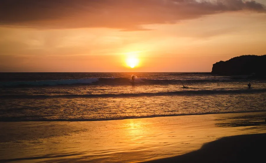 surfing at sunset Montañita ecuador