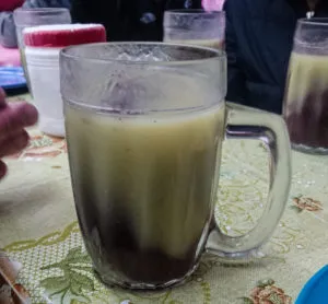 api morada mezclada mixed corn based drink drinks from Latin America purple corn maiz mais bolivia hot breakfast drink tankard inca latin south america travel guide blog couple drinks weird unusual