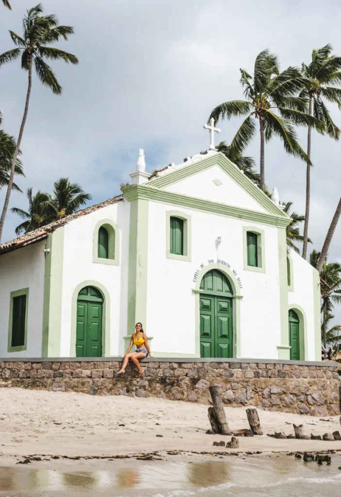 travel blogger girl on chapel on beach of praia dos carneirhos - 2 weeks north brazil itinerary