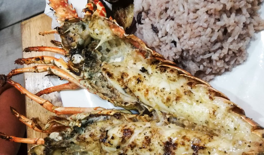 where to eat Caye Caulker Belize island grilled lobster on the street Oscar Da Crusted Crab restaurant curry