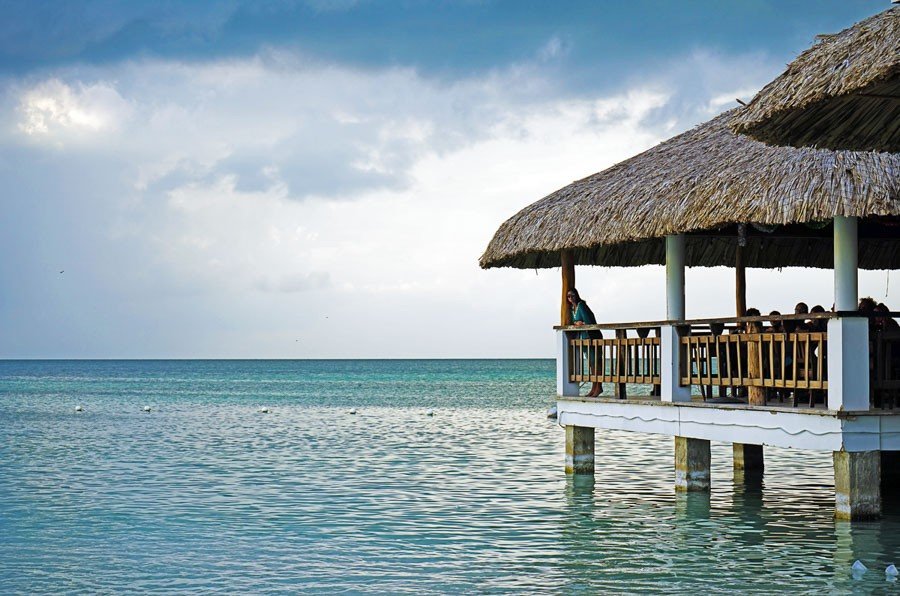 best central american beaches: koko king caye caulker belize jetty into sea