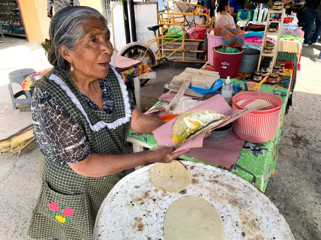 tortilla quesadilla senora in tlacolula market on sunday - oaxaca day trips