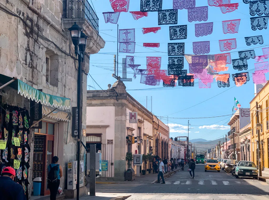 oaxacan market streets with dia de los muertos bunting - things to do in oaxaca mexico